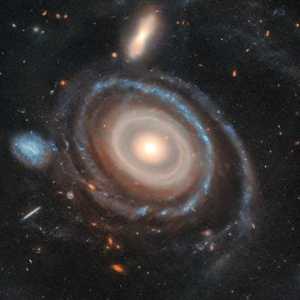 哈勃捕捉到“宇宙靶心”圖像：揭示令人驚嘆的九環(huán)星系